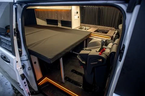Comfortable interior of a passenger bus with soft seats Stock Photos