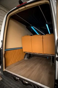 Comfortable interior of a passenger bus with soft seats Stock Photos