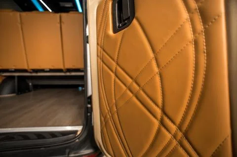 Comfortable interior of a passenger bus with soft seats Stock Photos