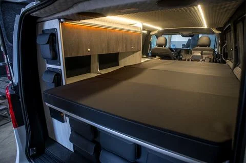 Comfortable interior of a passenger bus with soft seats 스톡 사진