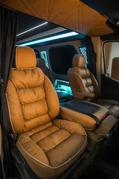 Comfortable interior of a passenger bus with soft seats Stock-Fotos