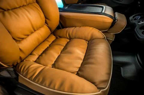Comfortable interior of a passenger bus with soft seats Stock Photos