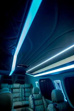 Comfortable interior of a passenger bus with soft seats Stock Photos