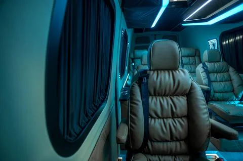 Comfortable interior of a passenger bus with soft seats Stock-Fotos
