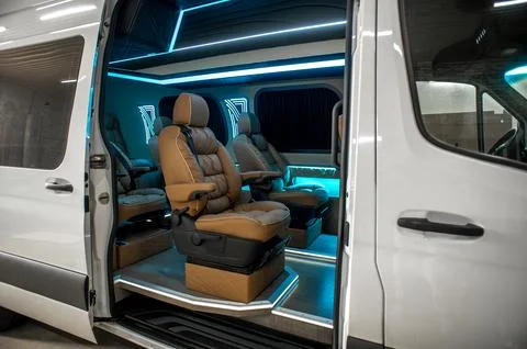 Comfortable interior of a passenger bus with soft seats Stock-Fotos