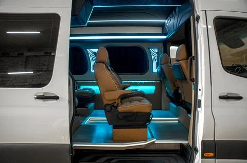 Comfortable interior of a passenger bus with soft seats Stock-Fotos