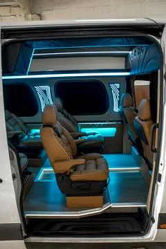 Comfortable interior of a passenger bus with soft seats 스톡 사진
