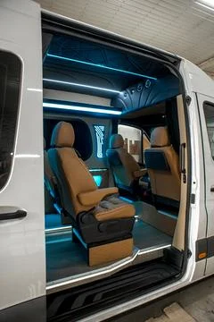 Comfortable interior of a passenger bus with soft seats Stock Photos