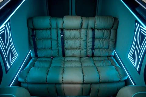 Comfortable interior of a passenger bus with soft seats Stock Photos