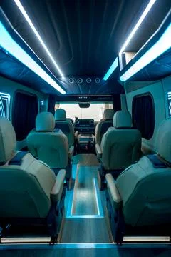 Comfortable interior of a passenger bus with soft seats Stock-Fotos