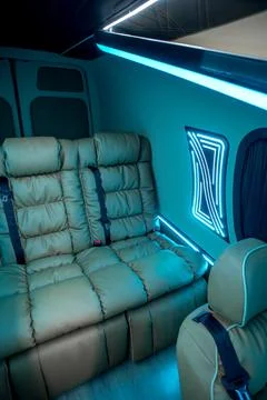 Comfortable interior of a passenger bus with soft seats Stock-Fotos