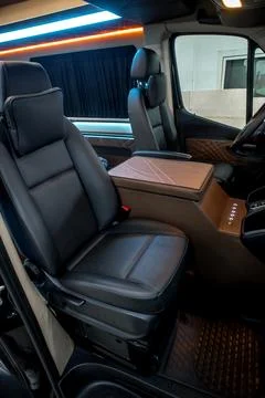 Comfortable interior of a passenger bus with soft seats Stock-Fotos