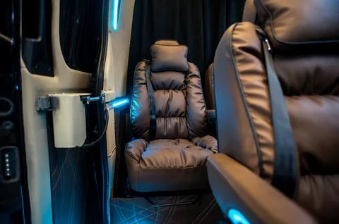 Comfortable interior of a passenger bus with soft seats Foto stock