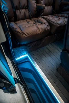 Comfortable interior of a passenger bus with soft seats Stock Photos