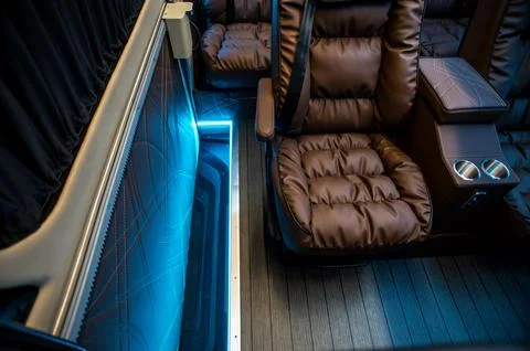 Comfortable interior of a passenger bus with soft seats Foto stock