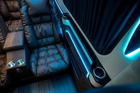 Comfortable interior of a passenger bus with soft seats 스톡 사진