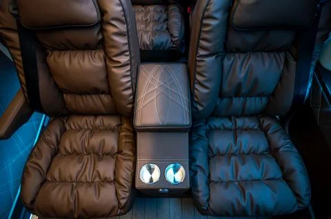 Comfortable interior of a passenger bus with soft seats Stock Photos