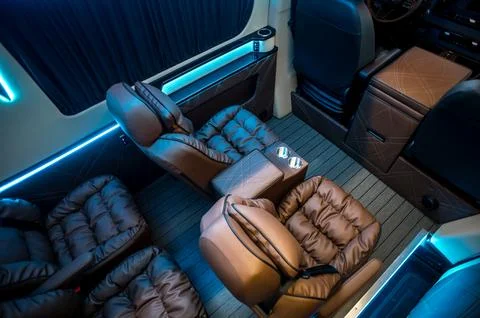 Comfortable interior of a passenger bus with soft seats Stock-Fotos