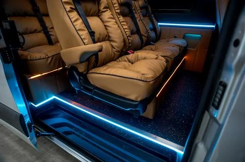 Comfortable interior of a passenger bus with soft seats Foto stock