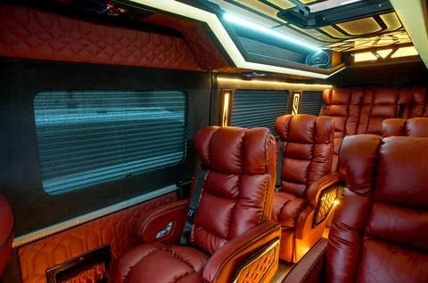 Comfortable interior of a passenger bus with soft seats Stock-Fotos