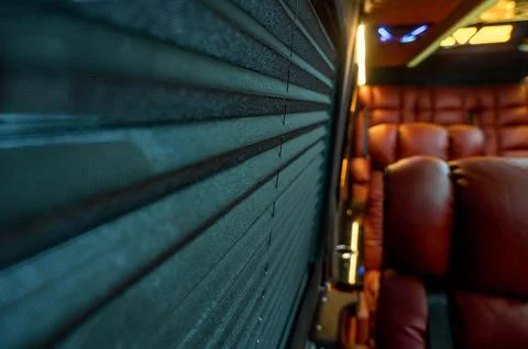 Comfortable interior of a passenger bus with soft seats Stock Photos