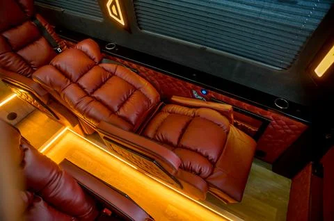 Comfortable interior of a passenger bus with soft seats Foto stock