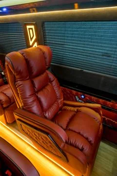 Comfortable interior of a passenger bus with soft seats Stock-Fotos