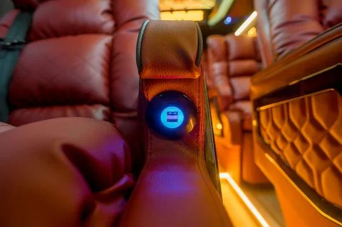 Comfortable interior of a passenger bus with soft seats Stock Photos