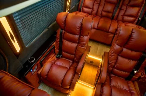 Comfortable interior of a passenger bus with soft seats Foto stock