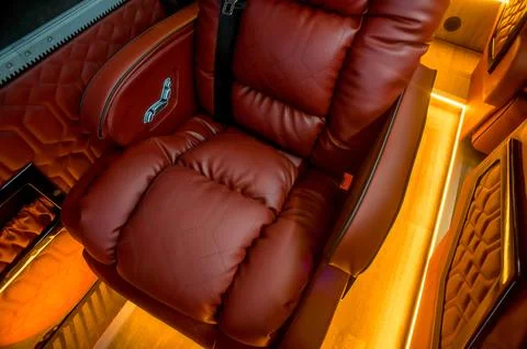 Comfortable interior of a passenger bus with soft seats Stock Photos