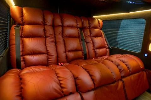 Comfortable interior of a passenger bus with soft seats Stock-Fotos