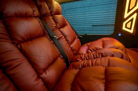 Comfortable interior of a passenger bus with soft seats Foto stock