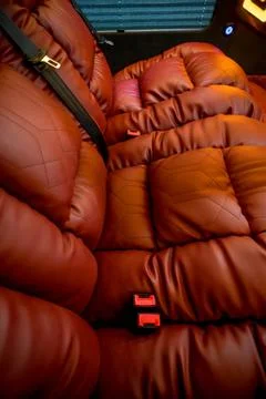 Comfortable interior of a passenger bus with soft seats Stock Photos