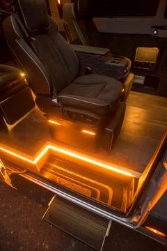 Comfortable interior of a passenger bus with soft seats Stock Photos