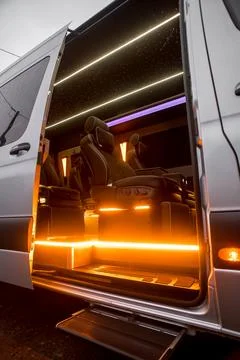 Comfortable interior of a passenger bus with soft seats Stock Photos