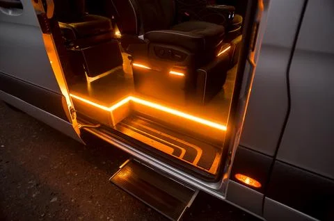 Comfortable interior of a passenger bus with soft seats Stock Photos