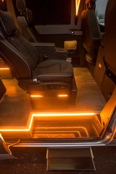 Comfortable interior of a passenger bus with soft seats Stock Photos