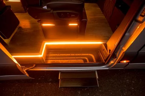 Comfortable interior of a passenger bus with soft seats Stock Photos
