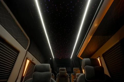 Comfortable interior of a passenger bus with soft seats Stock-Fotos