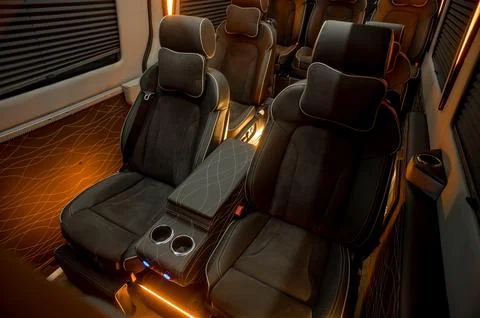 Comfortable interior of a passenger bus with soft seats Stock-Fotos