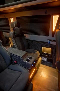 Comfortable interior of a passenger bus with soft seats Stock Photos
