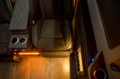 Comfortable interior of a passenger bus with soft seats Stock-Fotos