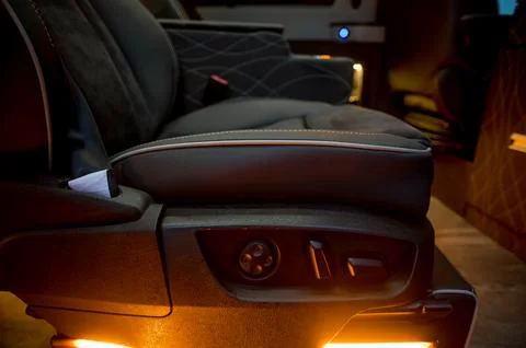 Comfortable interior of a passenger bus with soft seats Stock Photos