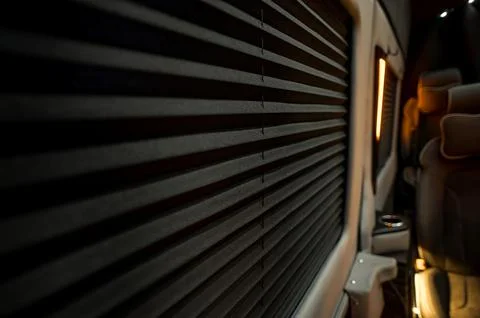 Comfortable interior of a passenger bus with soft seats Stock Photos