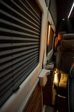 Comfortable interior of a passenger bus with soft seats Stock Photos