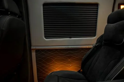 Comfortable interior of a passenger bus with soft seats Stock Photos