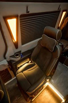 Comfortable interior of a passenger bus with soft seats Stock Photos