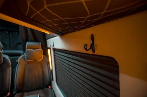 Comfortable interior of a passenger bus with soft seats Stock Photos