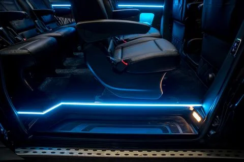 Comfortable interior of a passenger bus with soft seats Stock Photos