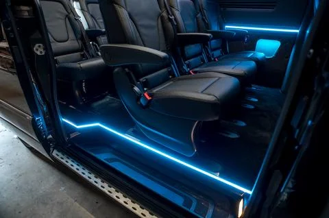 Comfortable interior of a passenger bus with soft seats Stock Photos